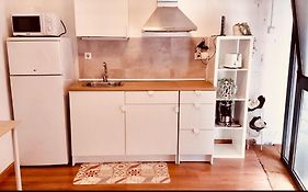 Room With Bathroom, Refrigerator And Microwave